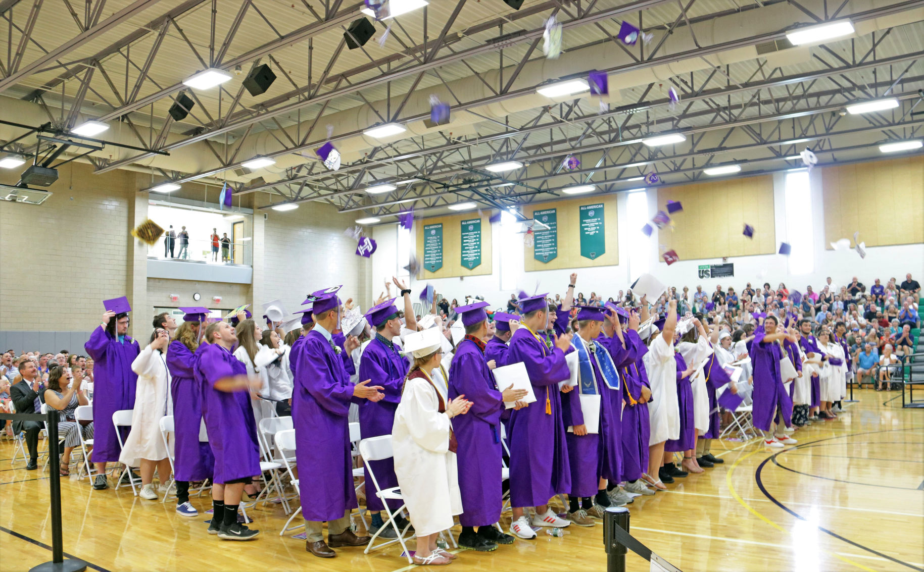 The Dryden High School Class of 2019 tosses their caps in celebration.